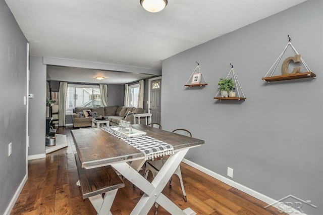 dining area with dark wood-type flooring