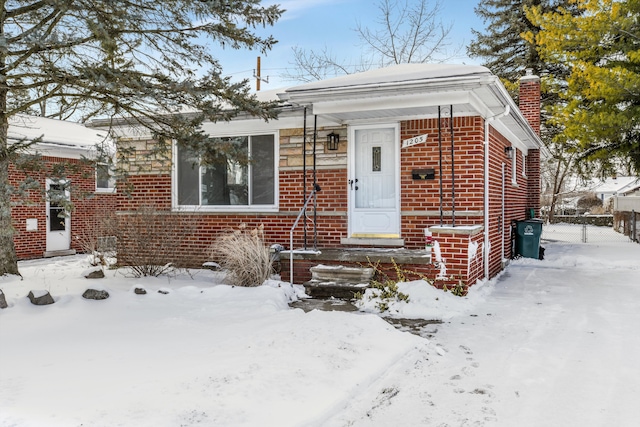 view of front of home featuring brick siding