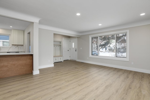 unfurnished living room with light wood-type flooring