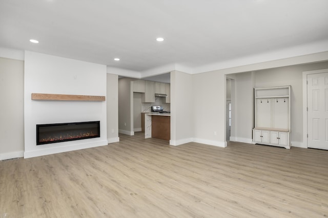 unfurnished living room featuring light hardwood / wood-style floors