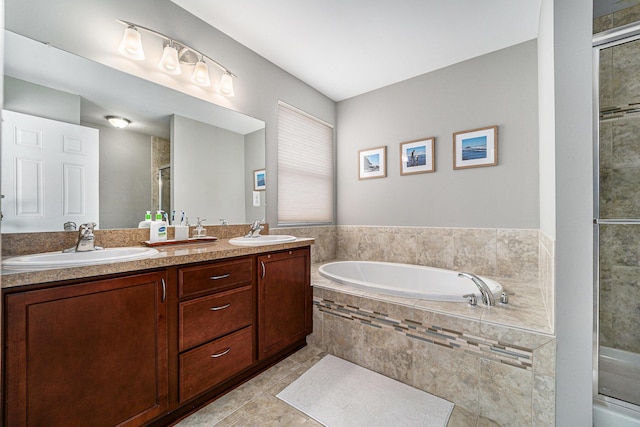 bathroom with vanity, tile patterned flooring, and independent shower and bath