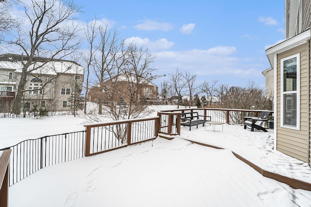 view of snow covered deck