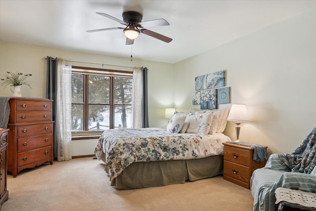 bedroom featuring light colored carpet and ceiling fan