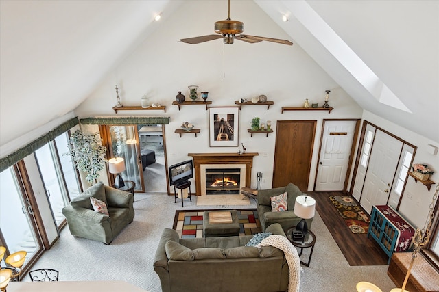 living room featuring ceiling fan, high vaulted ceiling, and hardwood / wood-style flooring