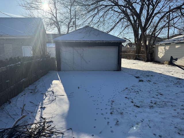 view of snow covered garage