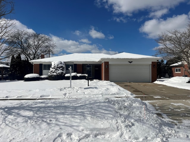 ranch-style house featuring a garage