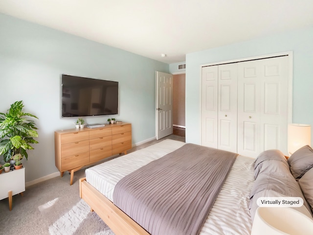 bedroom featuring a closet and carpet flooring