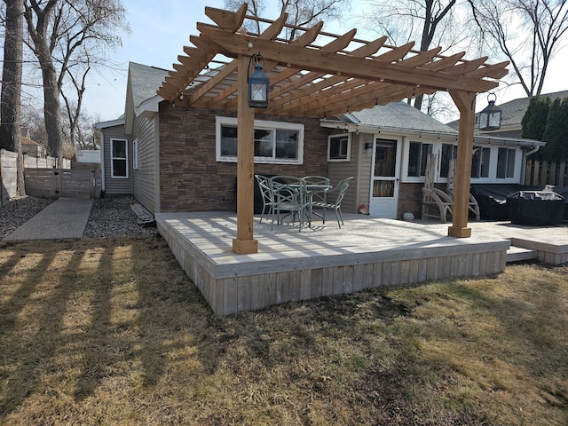 wooden terrace featuring a gate, a pergola, and fence