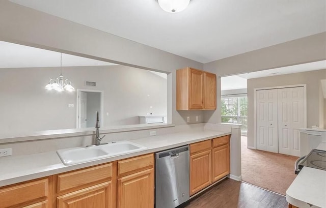 kitchen with a sink, light countertops, dishwasher, and hanging light fixtures