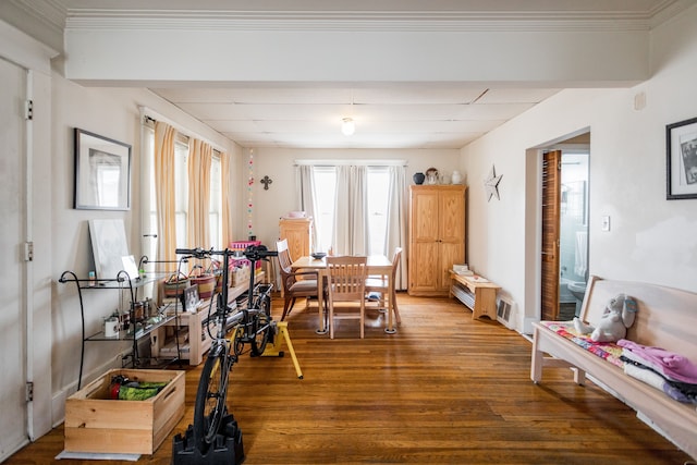 dining area featuring visible vents and wood finished floors