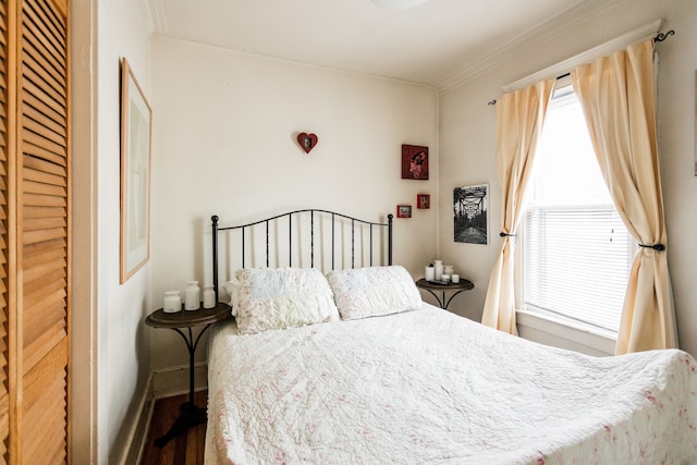 bedroom with crown molding