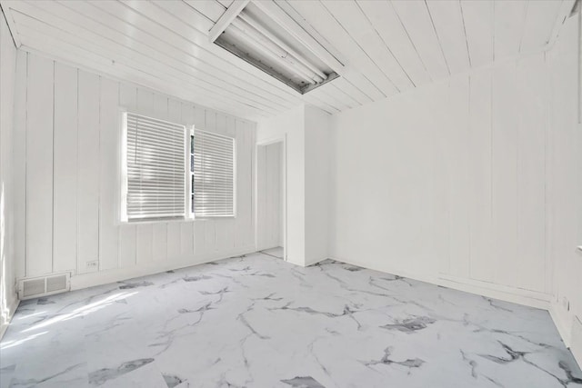 spare room with visible vents and marble finish floor