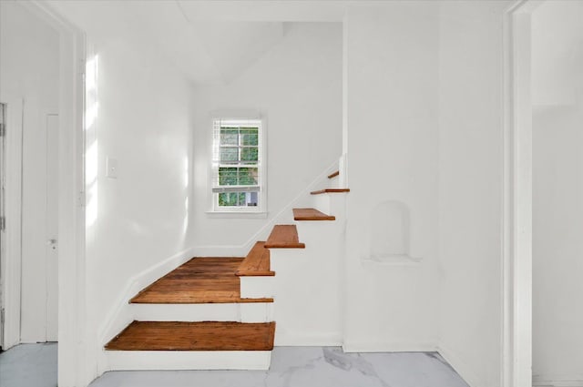stairway with marble finish floor