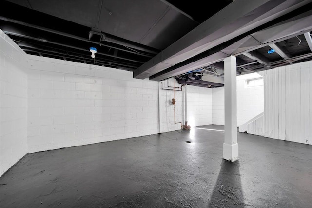 below grade area with concrete block wall