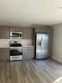 kitchen with stainless steel appliances and hardwood / wood-style floors