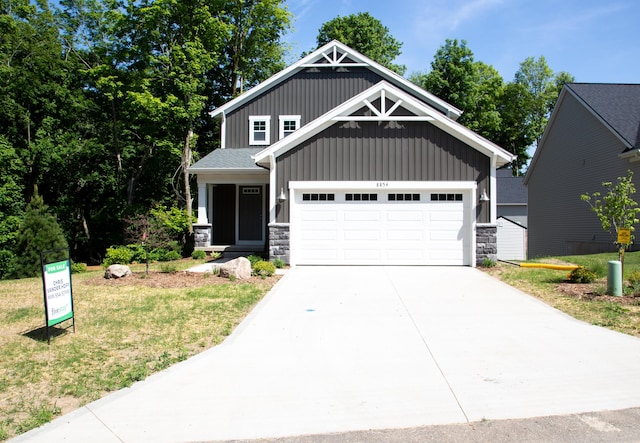 craftsman-style house with a front lawn