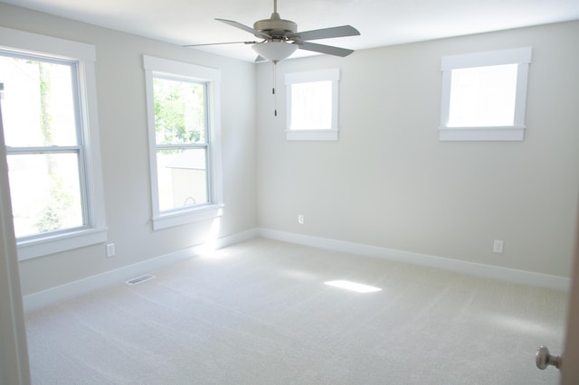 carpeted empty room with ceiling fan