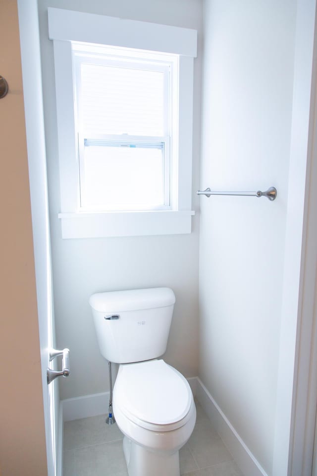 bathroom featuring tile patterned flooring and toilet