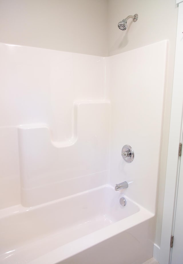 bathroom with bathing tub / shower combination