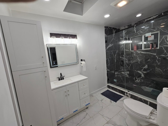 bathroom featuring vanity, an enclosed shower, and toilet