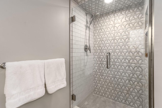 bathroom with a shower stall