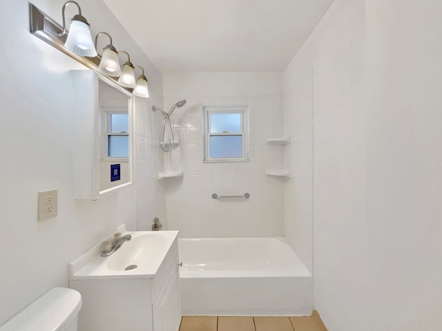 full bathroom featuring tiled shower / bath combo, vanity, toilet, and tile patterned flooring