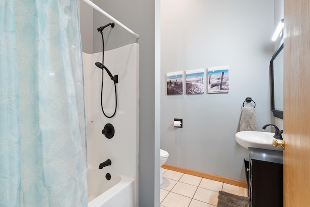 14113 Grandview Dr, Cement City, MI 49233 - bathroom featuring tile patterned flooring, toilet, vanity, shower / bath combo with shower curtain, and baseboards