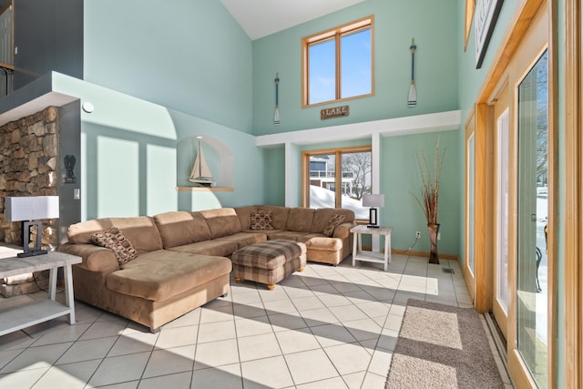 14113 Grandview Dr, Cement City, MI 49233 - living area featuring a wealth of natural light, high vaulted ceiling, and light tile patterned flooring