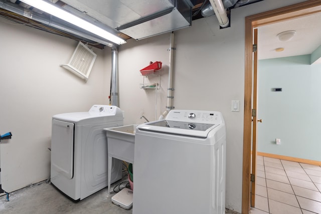 14113 Grandview Dr, Cement City, MI 49233 - washroom with washer and clothes dryer and laundry area