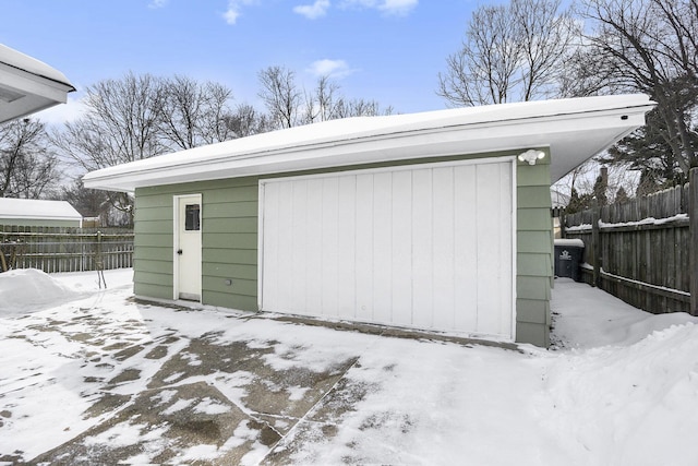 view of snow covered garage