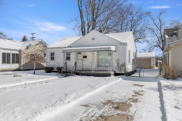 view of front facade with a garage and fence