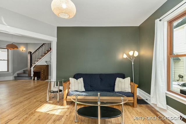 living room with hardwood / wood-style floors and a healthy amount of sunlight