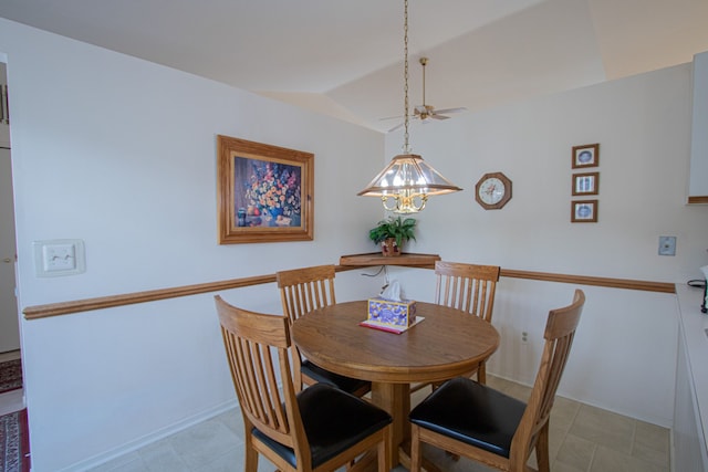 dining room with a notable chandelier and lofted ceiling