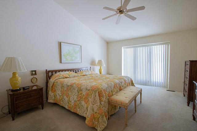 bedroom featuring light carpet, lofted ceiling, and ceiling fan