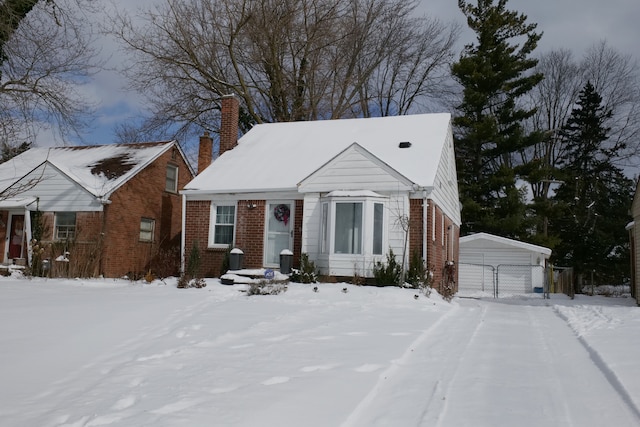 view of front facade featuring an outdoor structure and a garage