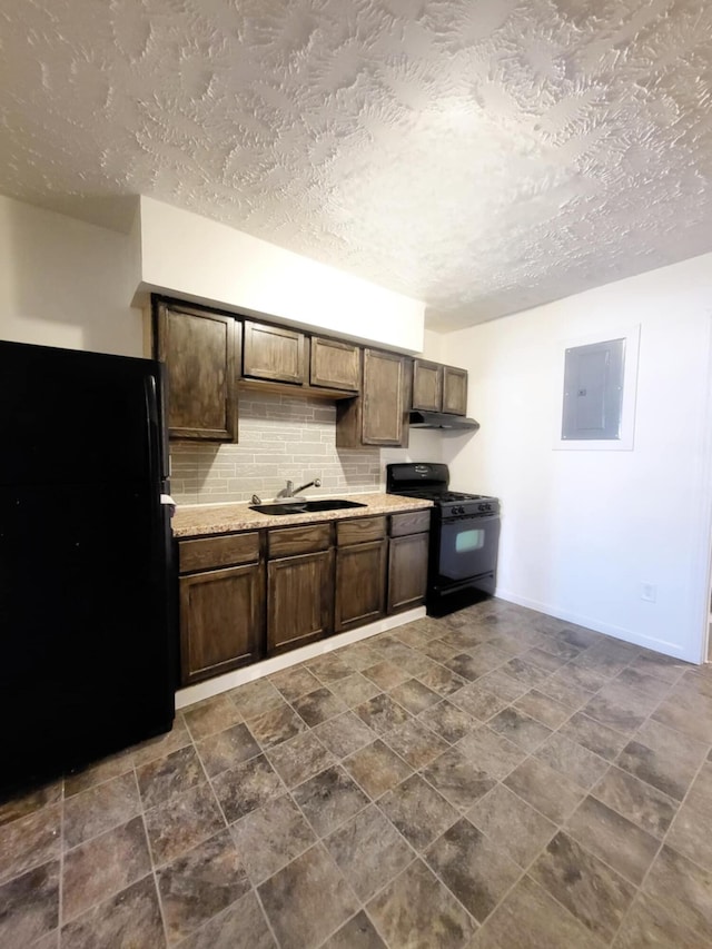kitchen featuring electric panel, a sink, light countertops, black appliances, and under cabinet range hood