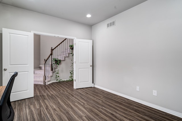 unfurnished office with baseboards, visible vents, dark wood-style flooring, and recessed lighting