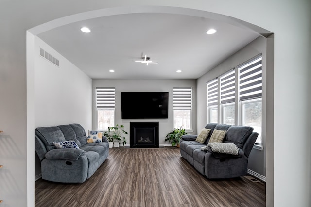 living room featuring recessed lighting, visible vents, and wood finished floors