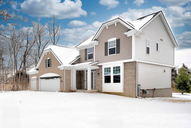 traditional-style home with an attached garage and brick siding