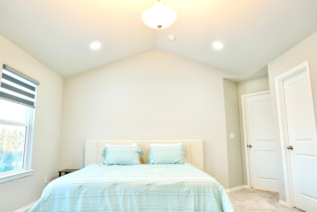 bedroom featuring recessed lighting, light carpet, vaulted ceiling, and baseboards