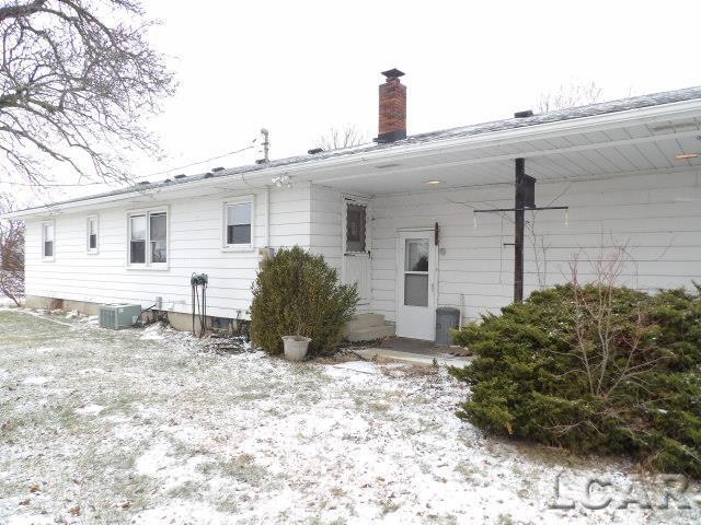 snow covered property featuring cooling unit