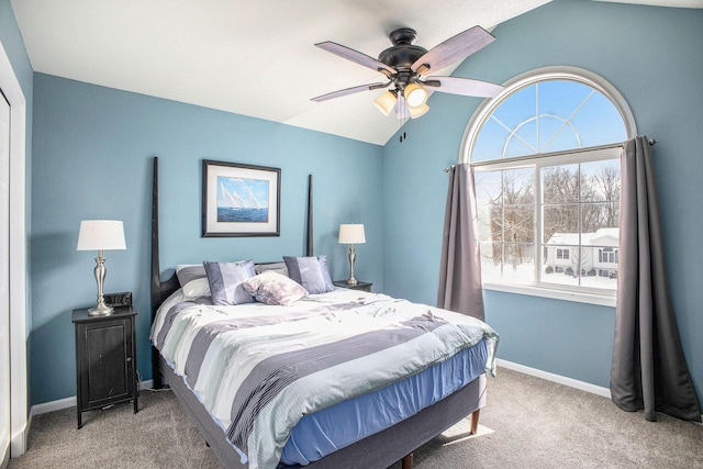 bedroom featuring ceiling fan, carpet flooring, and lofted ceiling