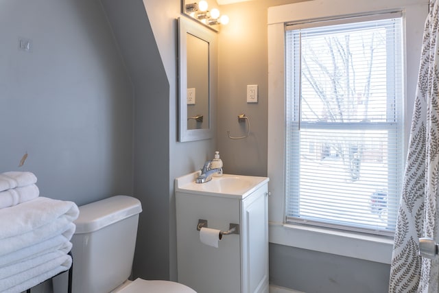 bathroom featuring vanity and toilet