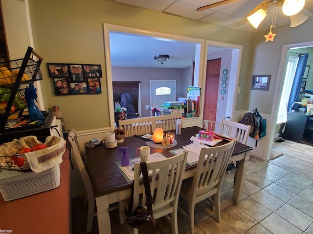 dining area featuring light tile patterned floors and ceiling fan