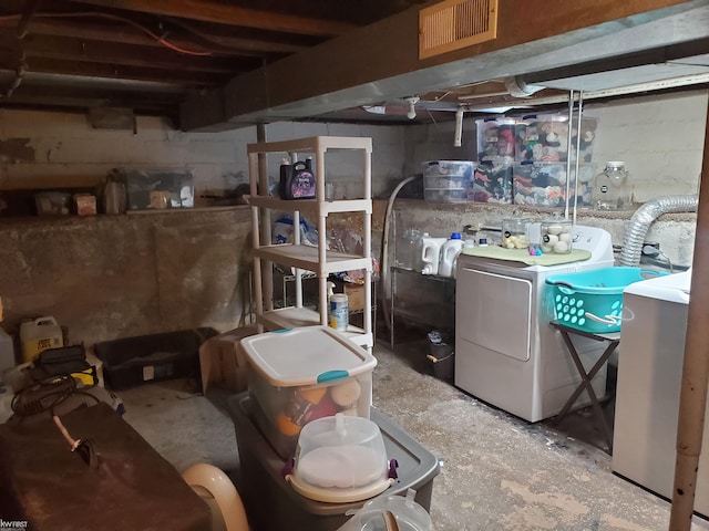 basement with separate washer and dryer