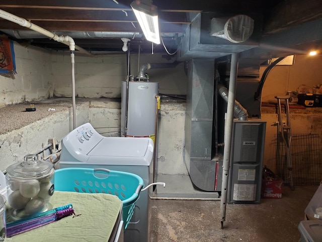 interior space with heating unit, water heater, and washer / clothes dryer