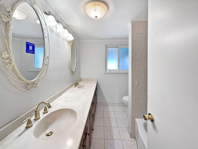 bathroom with tile patterned floors, toilet, vanity, and ornamental molding