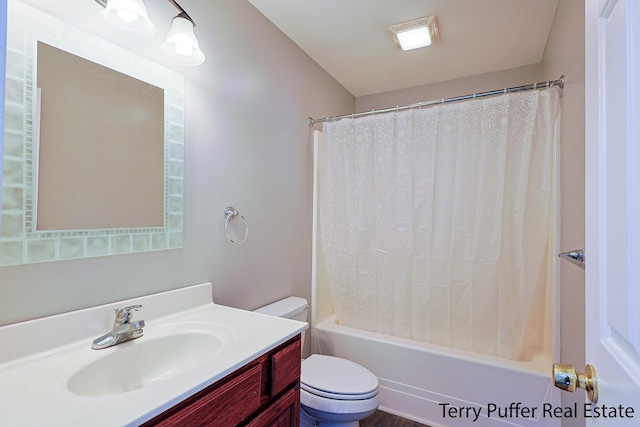 full bathroom with vanity, toilet, and shower / tub combo