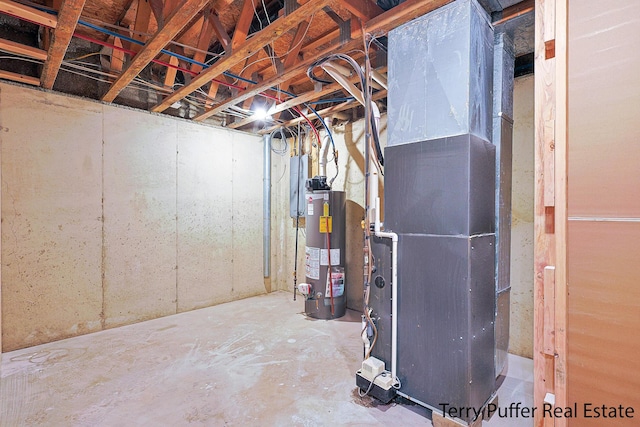 basement with electric panel and water heater