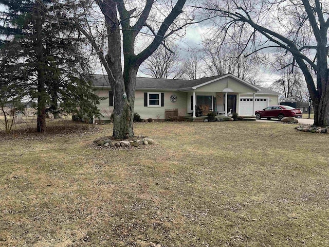 ranch-style house with a garage, a front lawn, and covered porch